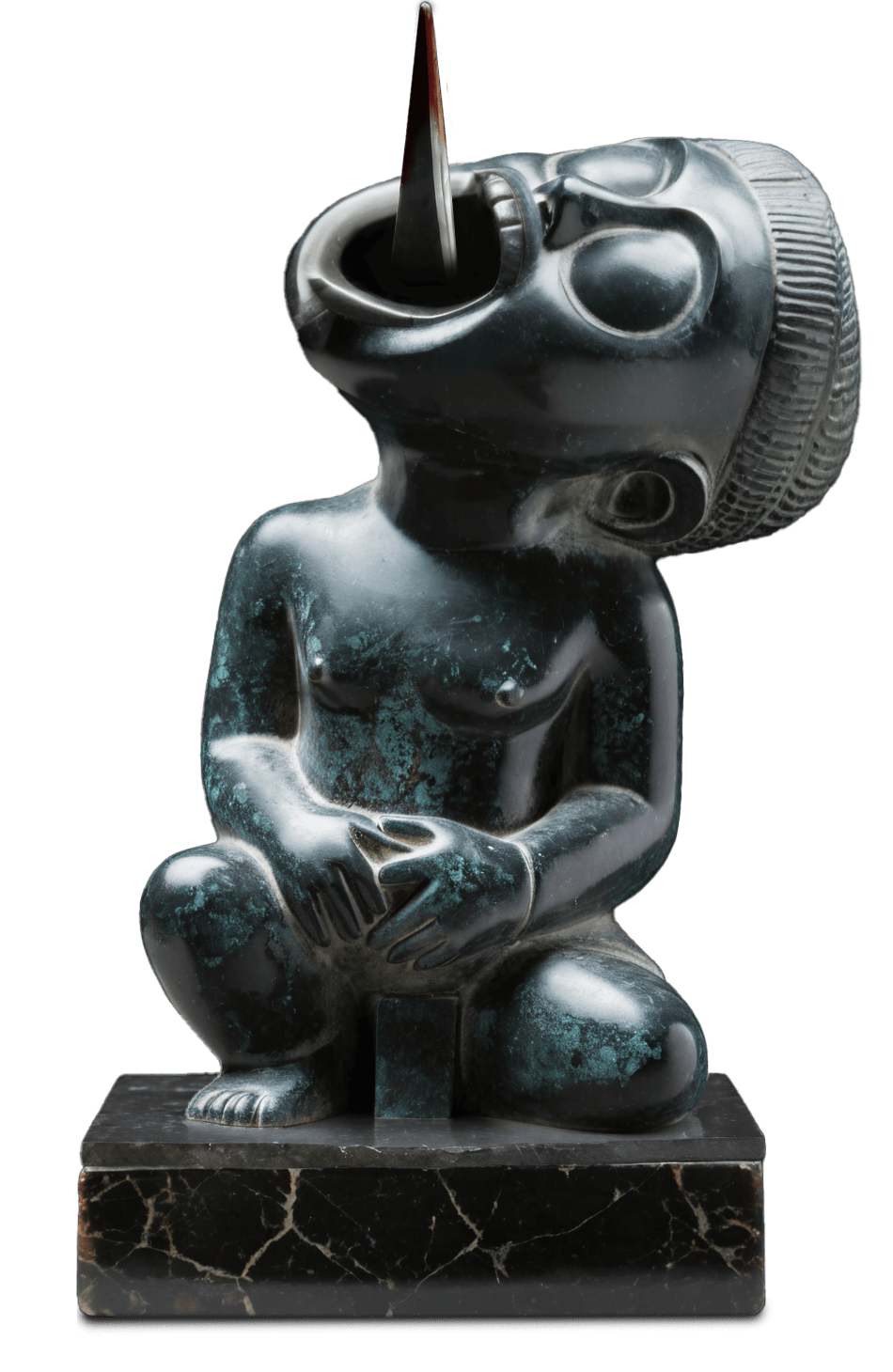 A creepy little black-stone statue kneels on a plinth, its head bent backwards, mouth wide, from which a sharp, spiked tongue protrudes upwards.